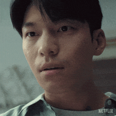 a close up of a man 's face with the word netflix on the bottom right