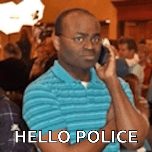 a man in a blue shirt is talking on a cell phone with the words hello police written below him .