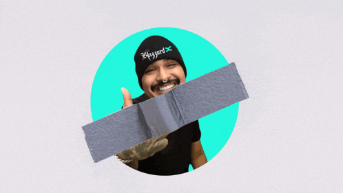 a man wearing a beanie that says blizzard is holding a piece of tape