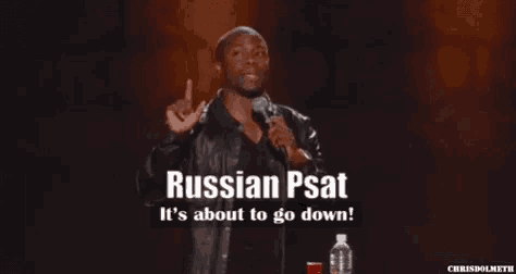 a man stands in front of a microphone and says russian psat