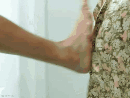 a close up of a person 's foot on another person 's leg .