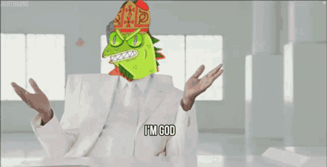 a man in a white suit is sitting at a table with a cartoon character on his head and says i 'm god