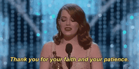 a woman is standing in front of a microphone and saying thank you for your faith and patience .
