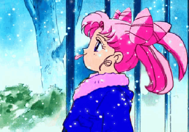 a little girl with pink hair is standing in the snow wearing a blue coat