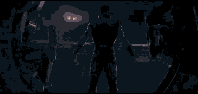 a man standing in a dark room with his arms outstretched .