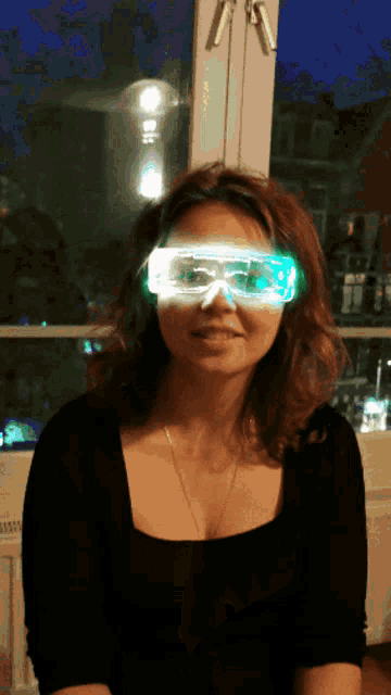 a woman wearing a pair of glow in the dark goggles