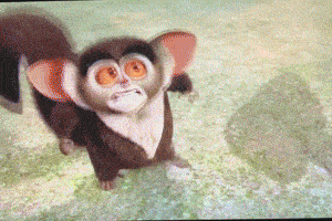 a cartoon monkey with big orange eyes is standing on a grassy field