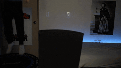 a poster on a wall that says akira is lit up in the dark