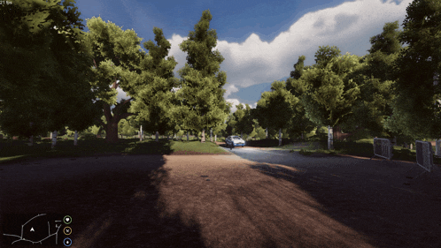 a blue car is parked on a dirt road in a park