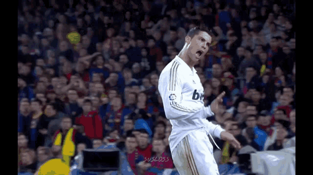 a soccer player wearing a white jersey that says bwin on it