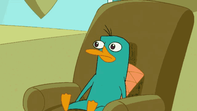 a cartoon perry the platypus sits in a chair with a pillow on his back