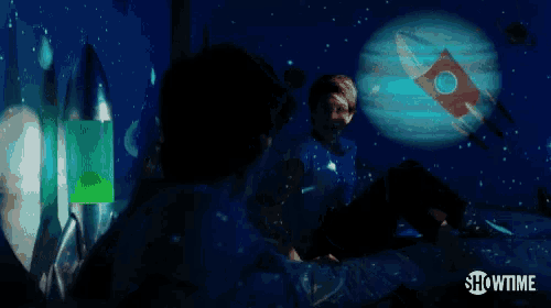 a showtime advertisement with a rocket being projected on a wall