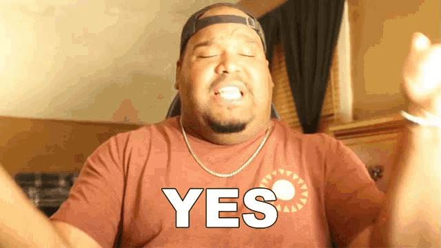 a man with his eyes closed is wearing a shirt that says yes