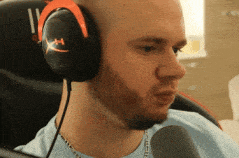a man wearing headphones with the letter x on it