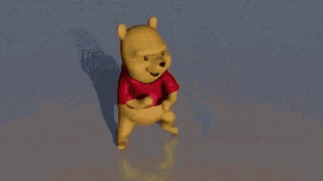 winnie the pooh is jumping in the air with his arms outstretched .