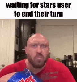 a bald man with a beard is holding a bag of chips in his hand .
