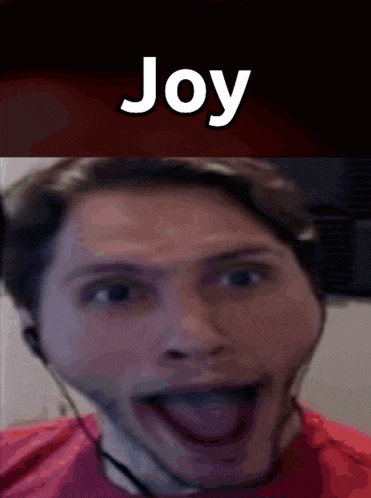 a close up of a man 's face with joy written on the top