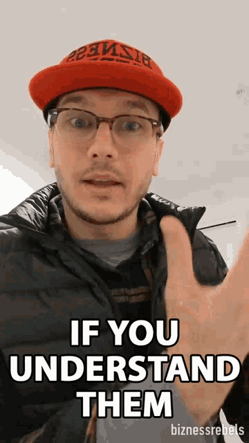 a man wearing a red hat and glasses says " if you understand them "