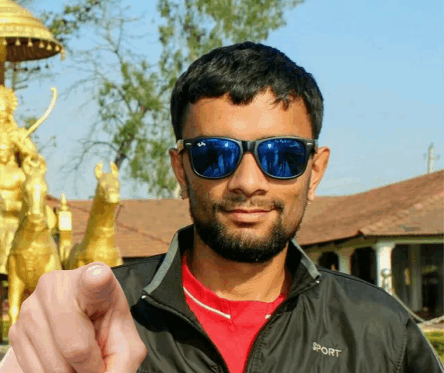 a man wearing sunglasses and a jacket that says sport on it