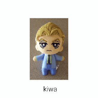 a stuffed toy of a man in a suit and tie is called kiwa