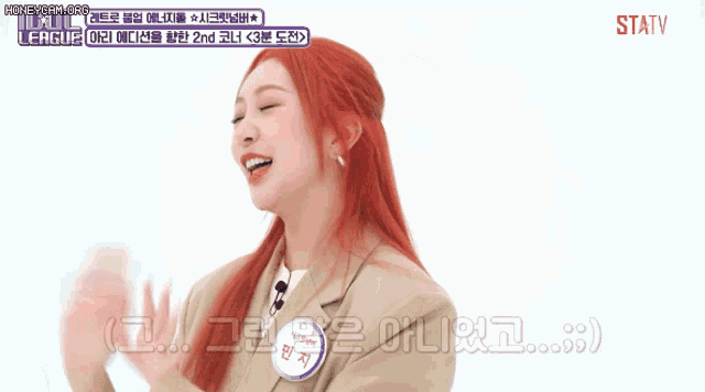a woman with red hair is talking in a korean language