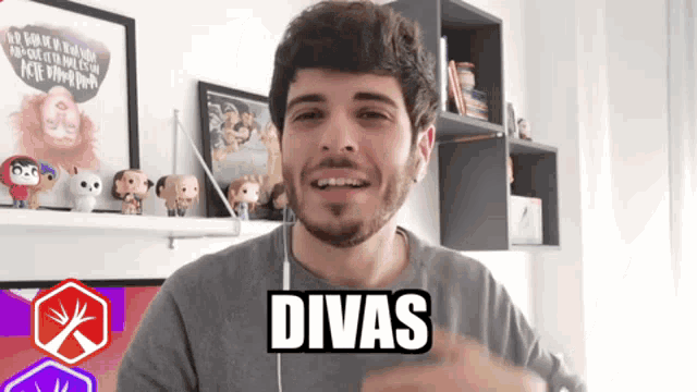 a man with a beard is wearing headphones and the word divas is on his chest