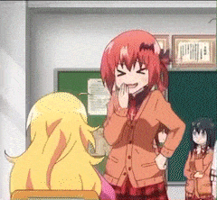 a girl with red hair is standing in front of a green board talking to another girl .
