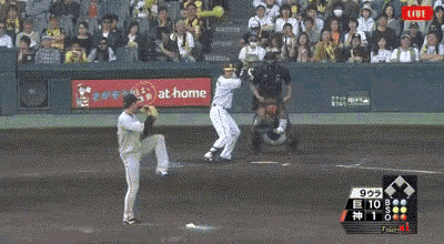 a baseball game is being played on a field with a banner for panasonic