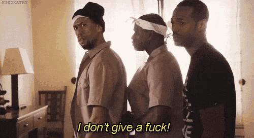 three men are standing next to each other in a room and one of them is saying `` i don t give a fuck ! ''
