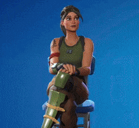 a woman is sitting on a chair with her legs crossed and holding a gun .
