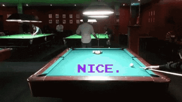 a pool table has the word nice on it
