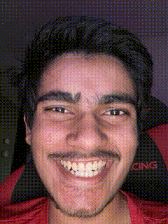 a close up of a man 's face with a red shirt that says cing on it
