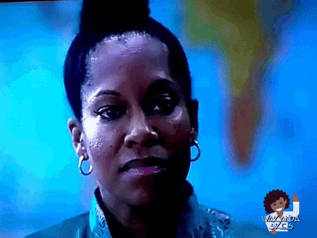 a close up of a woman 's face with a blue background and a sign that says ' vawanda 365 '