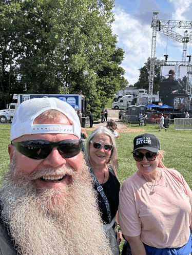 a man with a beard wears a white hat that says i 'm a bitch