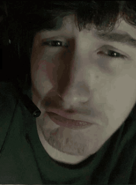 a close up of a man wearing a headset on his face