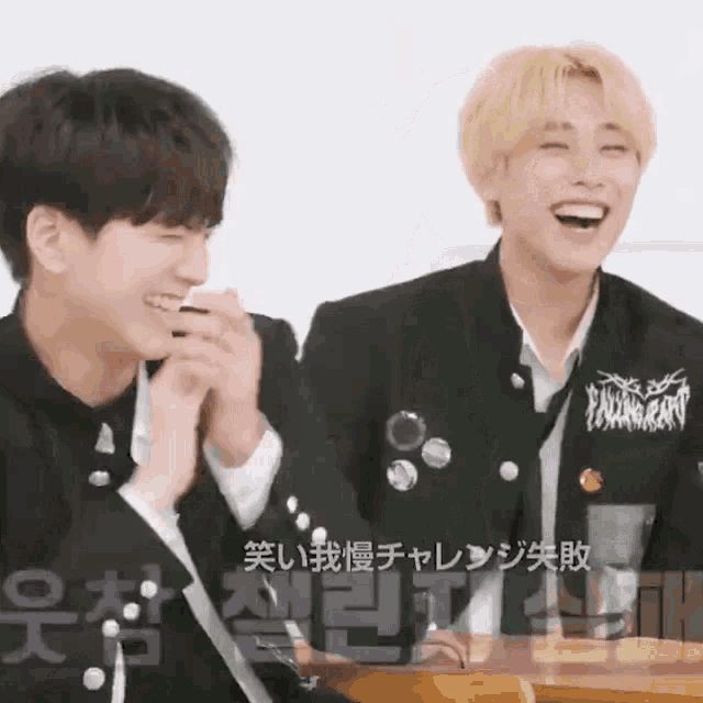two young men are laughing and one has a shirt that says ending story on it