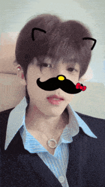 a young man with a cat ear and a mustache