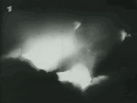 a black and white photo of a person 's shadow on a wall