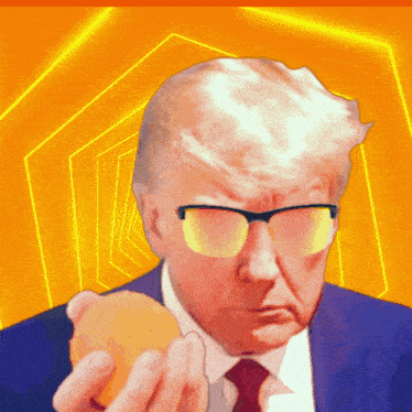 a man wearing glasses and a suit holds an orange