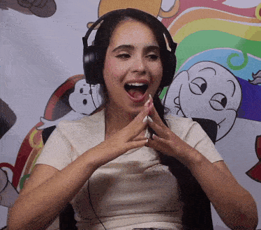 a woman wearing headphones has her mouth open