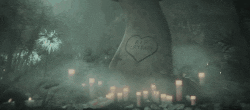 a grave with a heart that says rip crying