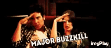 a man and a woman holding a baby with the words major buzzkill written on the bottom