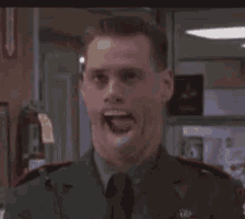 a man in a military uniform is smiling and looking at the camera
