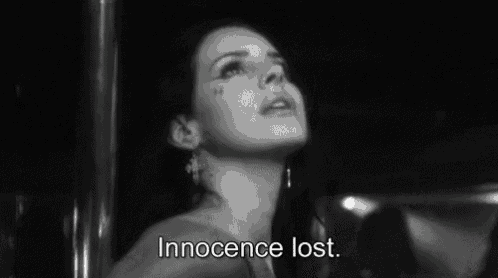 a black and white photo of a woman with the words `` innocence lost '' .