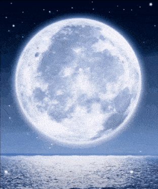 a full moon rises over a body of water at night