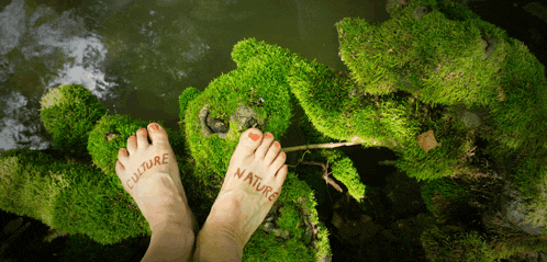 a woman 's feet are painted with the words culture and nature