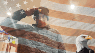 a man salutes in front of an american flag while a bald eagle looks on
