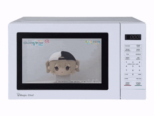 a white magic chef microwave with a picture of a stuffed animal on the screen