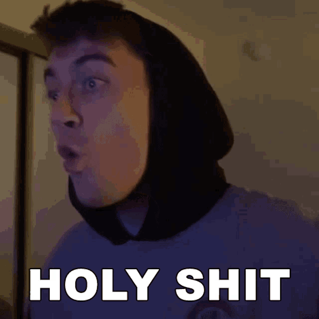 a man in a hoodie says holy shit