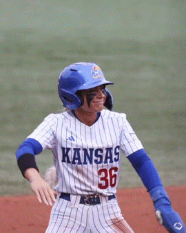 a baseball player wearing a jersey that says kansas
